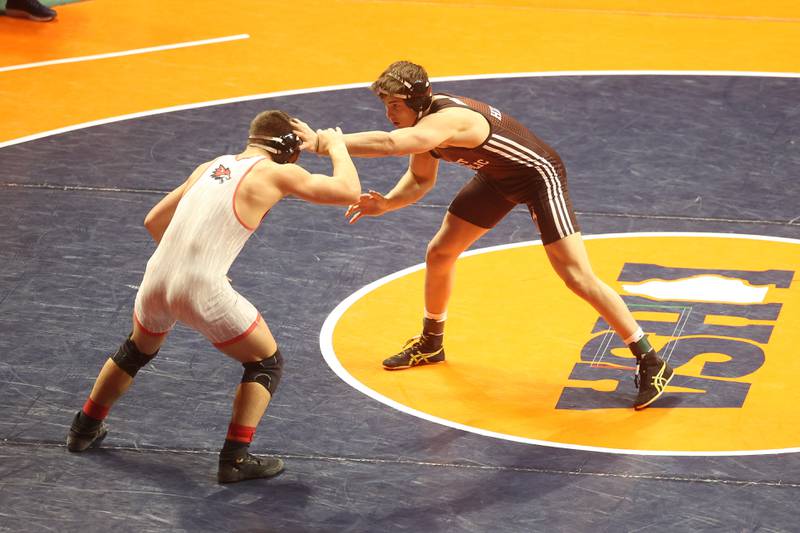 Joliet Catholic’s Max Corral takes on Dekalb’s Jacob Luce in the 165-pound Class 3A state 5th place match on Saturday, Feb. 17th, 2024 in Champaign.