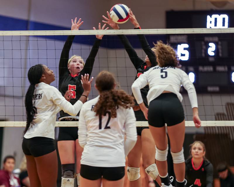 Sandwich's Jordan Bauer (3) blocks a kill attempt during volleyball match between Sandwich at Plano.  August 21, 2023.