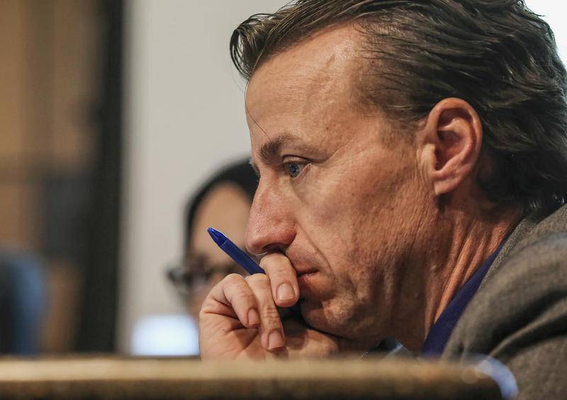 Marty Shanahan, who took out petitions for the April city council election in Joliet, looks over a budget report during a council meeting in December 2018 when he was serving as interim city manager.