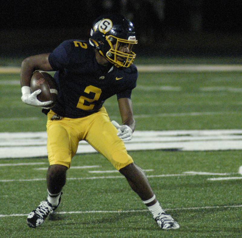 Sterling 's Kaedon Phillips makes a cut against Rock Island. Action took place on Friday, October  18th, 2024 in Sterling.