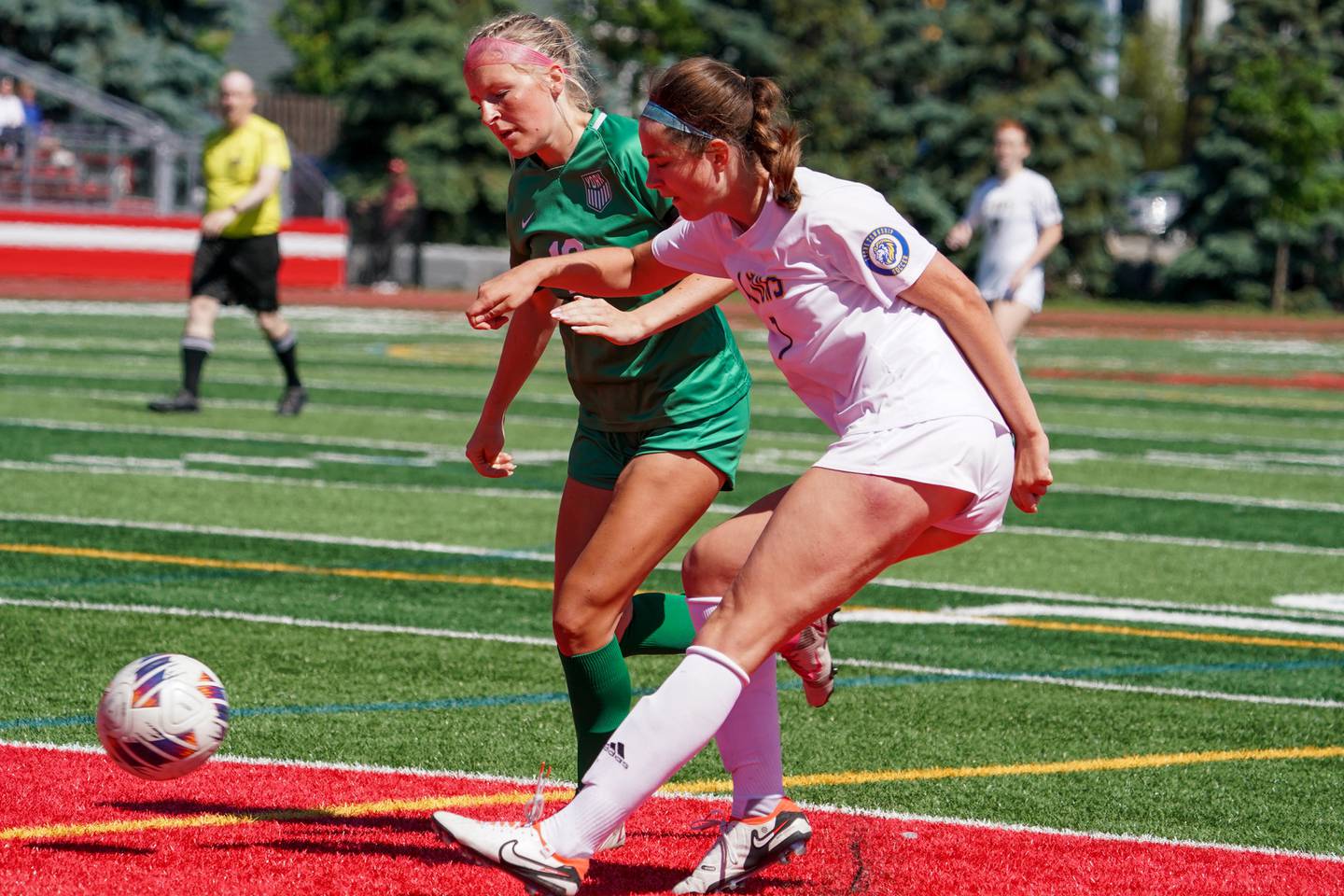 Lyons’ Caroline Mortonson (7) shoots the ball against York’s Ava Hansmann (19) during a Class 3A Hinsdale Central Sectional girls soccer championship match at Hinsdale Central High School on Saturday, May 25, 2024.