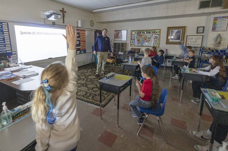 State Representative Brad Fritts asks state of Illinois trivia questions Thursday, Feb. 1, 2024 to students of St. Mary’s School in Dixon. Local professionals were brought in for fun and education with the students in celebration of Catholic Schools Week.