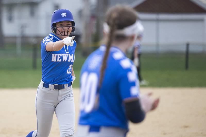 Newman’s Madison Duhon celebrates with teammates after hitting a home run against Dixon Thursday, April 11, 2024 at Reynolds Field in Dixon.