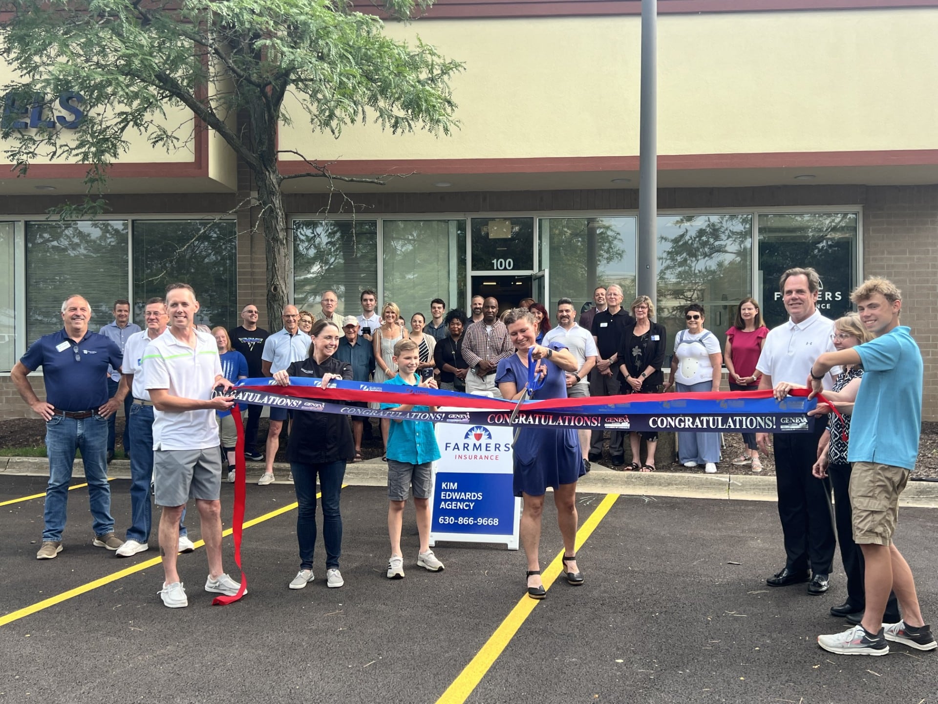 Kim Edwards cuts the ribbon outside her new Farmer's Insurance office during a  joint event by the Geneva, Elburn, and Western DuPage Chambers of Commerce on July 22, 2024, at 1772 Randall Rd., Suite 100 in Geneva.