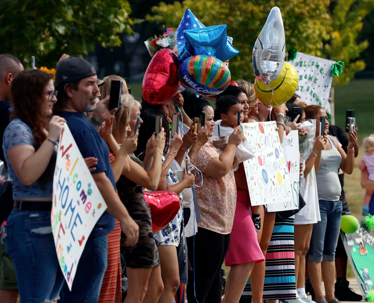 Family and friends wait Tuesday at the U.S. Army Reserve Center in Arlington Heights for members of the 1304th Military Police Company as they returned from a nine-month mission in Guantanamo Bay, Cuba.