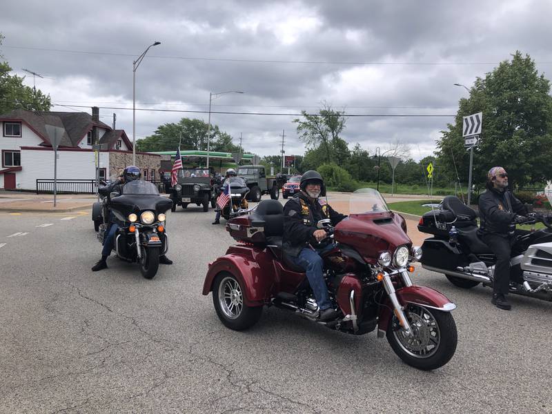 Motorcycles go around the Chapel Hill/ Johnsburg Road roundabout during the Johnsburg Memorial Day parade Monday May 27, 2024.