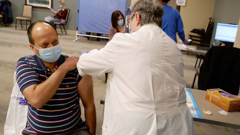 Dr. Irfan Hafiz, an infectious disease specialist and chief medical officer at Northwestern Medicine Hospitals in Huntley, McHenry and Woodstock, received his vaccine Tuesday, Dec. 29, 2020, at Northwestern Medicine Huntley Hospital.