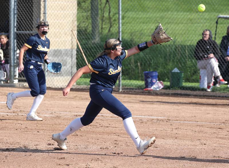 Sterling's Sienna Stingley tries to catch a soft liner back to the mound during their game against Sycamore Tuesday, May 14, 2024, at Sycamore High School.