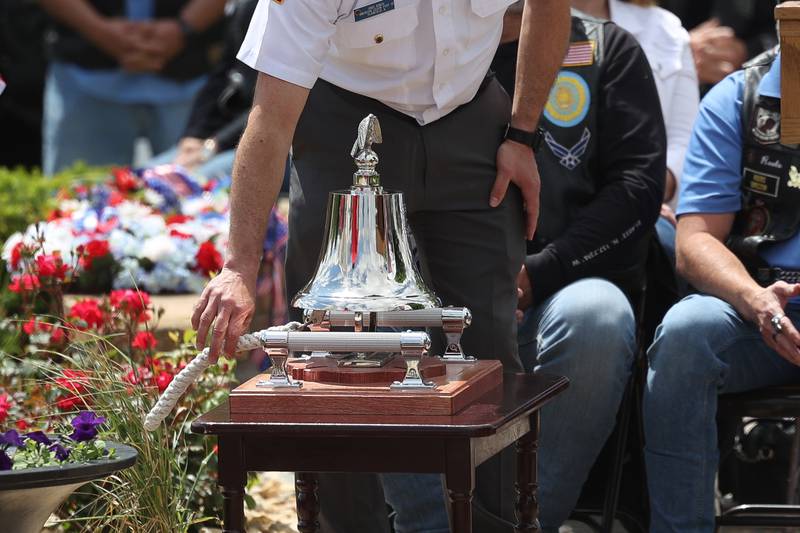 Greg Roach of the American Legion Post 13 rings the bell as names of Plainfield natives who lost their lives in service are read at Plainfield’s Memorial Day and Ceremony event on Monday, May 27, 2024.