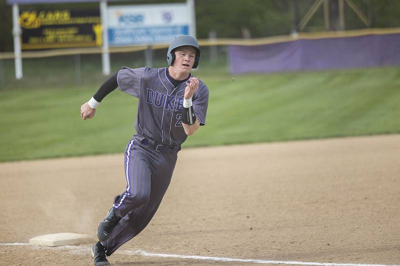 Dixon’s Aiden Wiseman rounds third base against Rock Falls to score Monday, April 22, 2024 in Dixon.