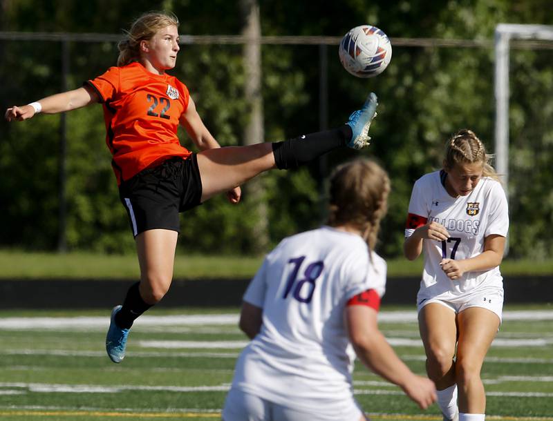 Crystal Lake Central's Olivia Anderson tries to kick the ball away from Wauconda's Ava Hortillosa during the IHSA Class 2A Grayslake North Regional championship soccer match on Friday, May 17, 2024, at Grayslake North High School. Anderson received a yellow card on the play.