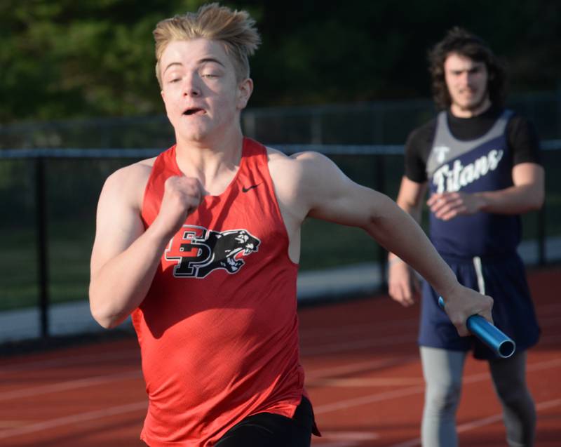 Erie-Prophetstown's Braden Morrel runs with the baton in the 4x100 relay at the Ed Schmidt Invitational Track Meet at Erie High School on Friday, April 19, 2024.