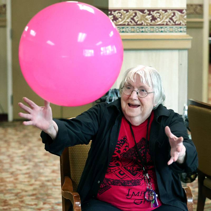 Barb City Manor resident Shirley Woody keeps her eyes on the ball during a scheduled activity Tuesday, July 2, 2024, at the retirement home in DeKalb. Barb City Manor celebrated its 45th anniversary earlier this year.