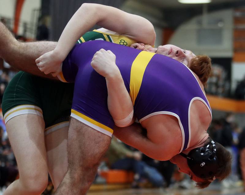 Wauconda’s Nick Bennett, bottom, is thrown by Crystal Lake South’s Dom Ariola in a 170-pound bout during IHSA Class 2A regional wrestling at Crystal Lake Central Saturday.