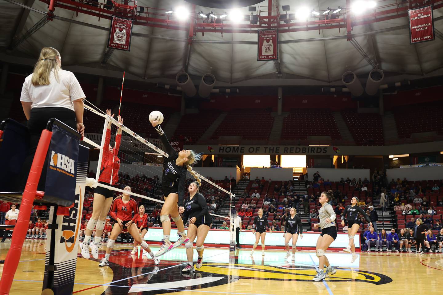 Newman’s Jess Johns punches over a shot against Norris City-Omaha-Enfield in the Class 1A third-place match Saturday, Nov. 12, 2022, in Normal.