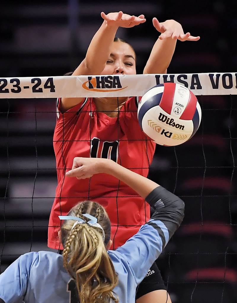 Barrington’s Berkeley Ploder blocks a shot by Willowbrook’s  Elle Bruschuk in the Class 4A girls volleyball state third-place match at Illinois State University in Normal on Saturday, October 11, 2023.