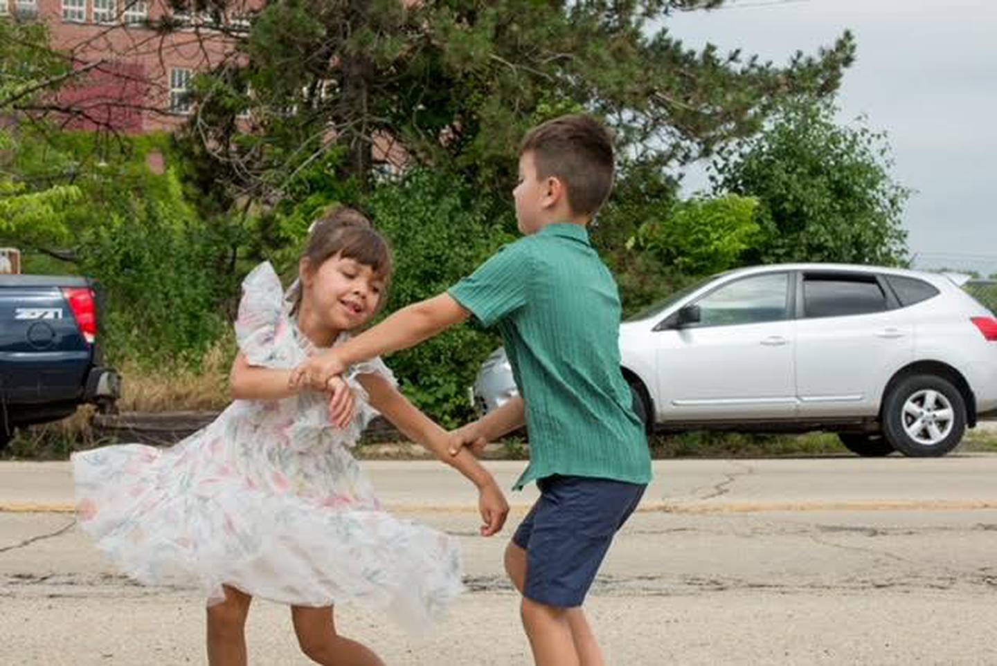 Dr. H.K. Sutton and Seattle have 23 grandchildren. Two of them, siblings Sienna and Nolan of Tennessee, entertain with their swing dancing talent Saturday, June 29, 2024, before joining the Dr. Sutton River Walk.