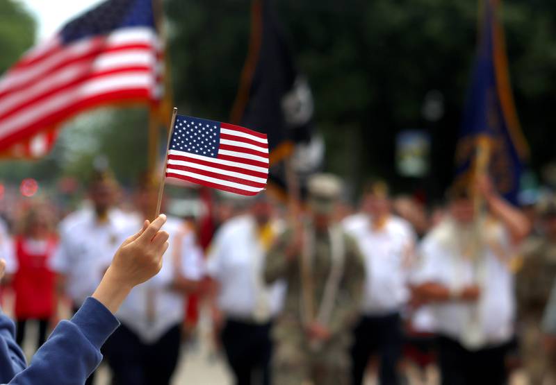 A youngster salutes veterans at the beginning of Huntley’s Memorial Day Parade Monday.