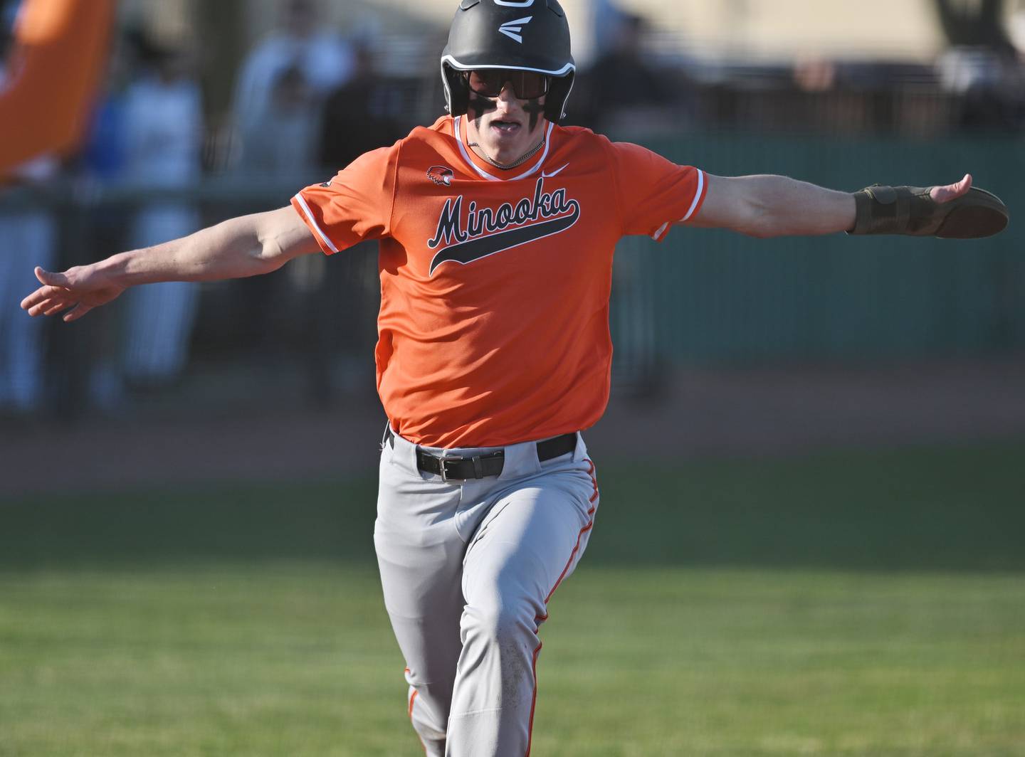 Minooka's Nate George crossing home plate during the non-conference game against Joliet Catholic on Monday, March. 11, 2024, at Joliet.