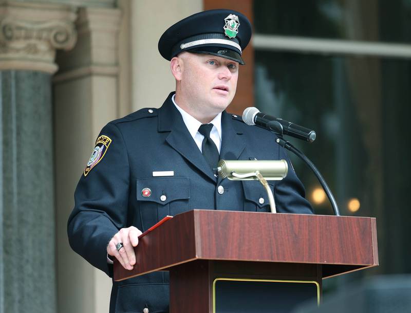 Keynote Speaker Jason Goodwin, a US Marine Corps veteran and DeKalb Police Sergeant, makes his remarks Monday, May 27, 2024, during the DeKalb Memorial Day program at Ellwood House.