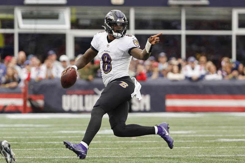 Baltimore Ravens quarterback Lamar Jackson runs against the New England Patriots during an NFL football game at Gillette Stadium, Sunday, Sunday, Sept. 24, 2022 in Foxborough, Mass. (Winslow Townson/AP Images for Panini)