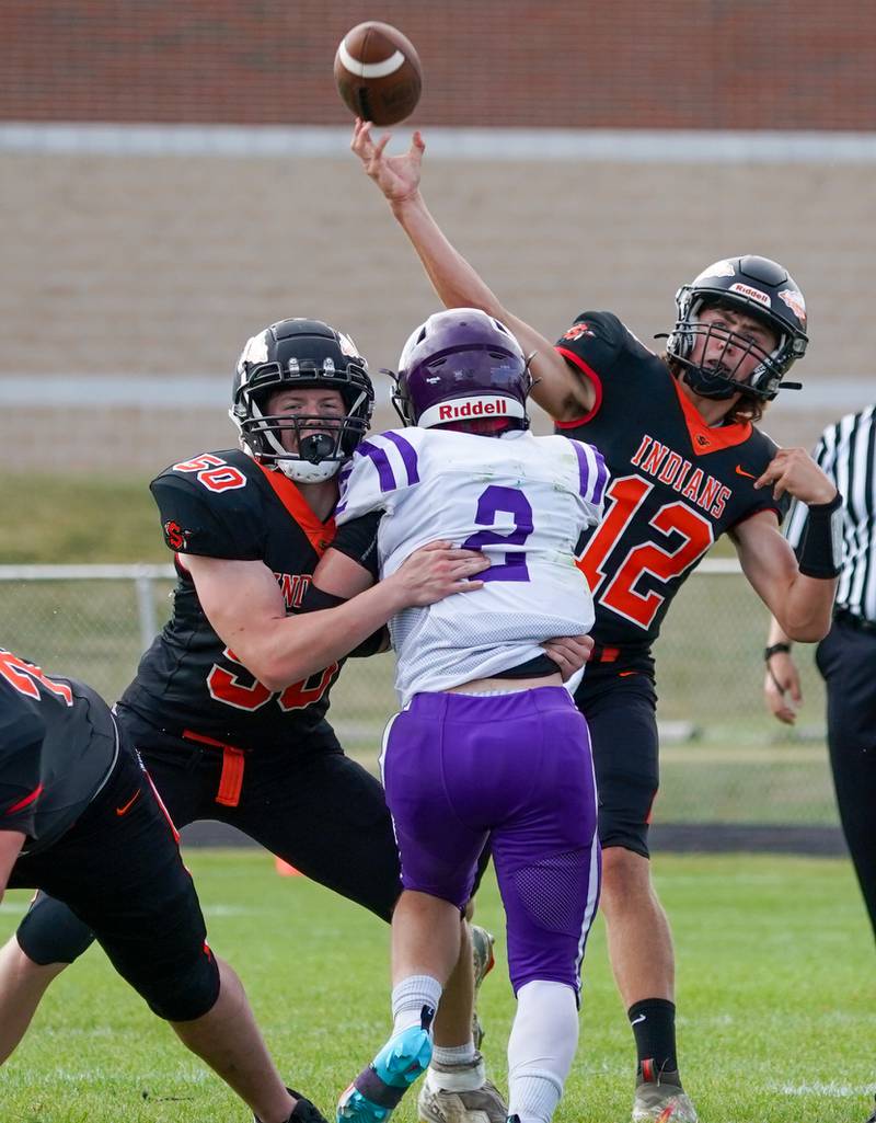 Sandwich Brady Behringer (12) throws a pass against Manteno during a football game at Sandwich High School on Saturday, Aug 26, 2023.