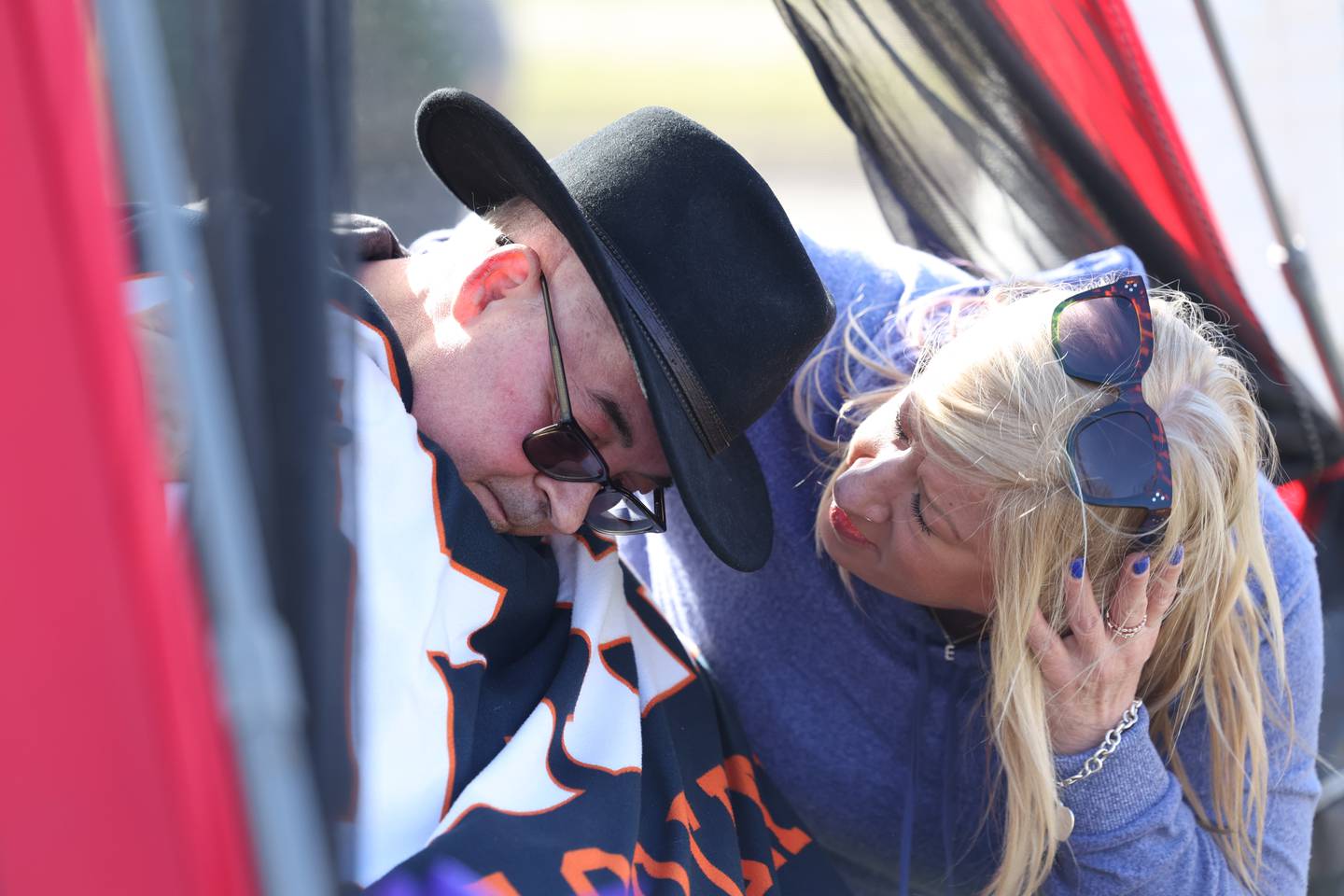 Amy Madison talks with her brother-in-law Tom Hernandez at a drive-by parade in his honor on Saturday, March 16, 2024 in Plainfield.