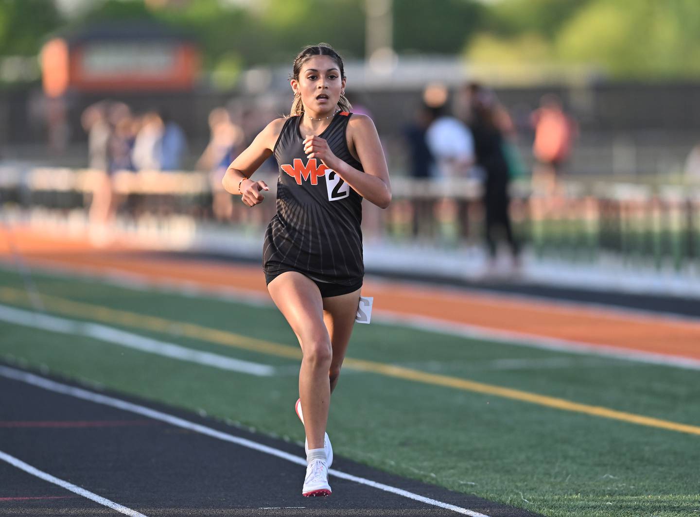 Minooka's Maya Ledesma legs out the 1,600-meter run during the 3A sectional track meet Wednesday, May 8, 2024, at Minooka.