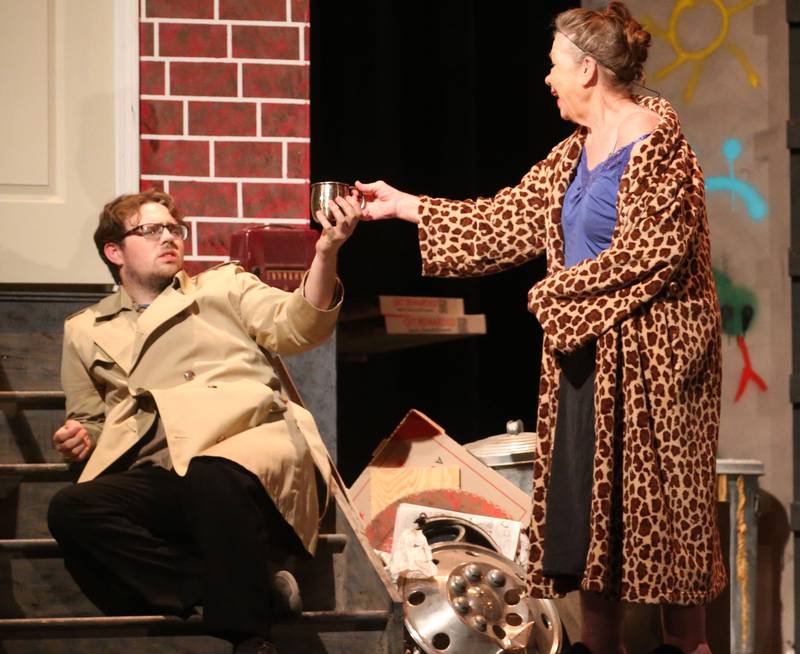 Matthew Grenter and Linda Whitmore as residents of Skid Row act out a scene during a rehearsal of  "The Little Shop of Horrors"  in the Mendota Community Theatre on Monday, June 17, 2024 at Mendota High School.