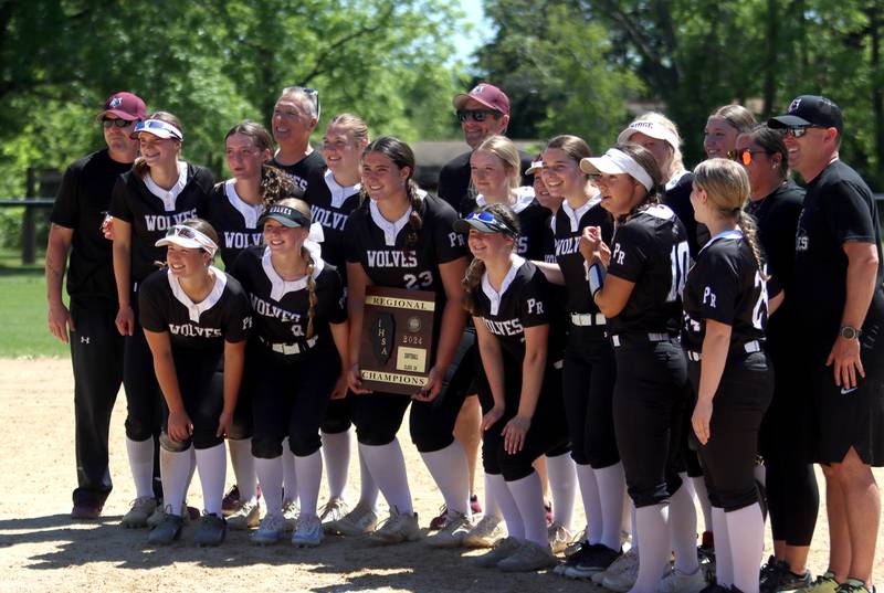 Prairie Ridge’s Wolves celebrate  a win over Harvard during Class 3A softball regional final action at Lions Park in Harvard Saturday.