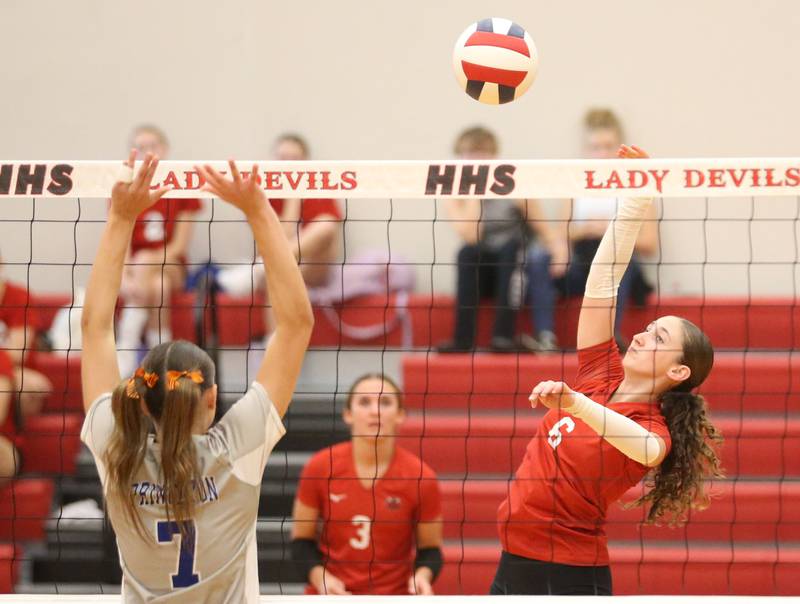 Hall's Kaitlyn Couttss spikes the ball past Princeton's Kathy Maciczak on Tuesday, Sept. 17, 2024 at Hall High School.