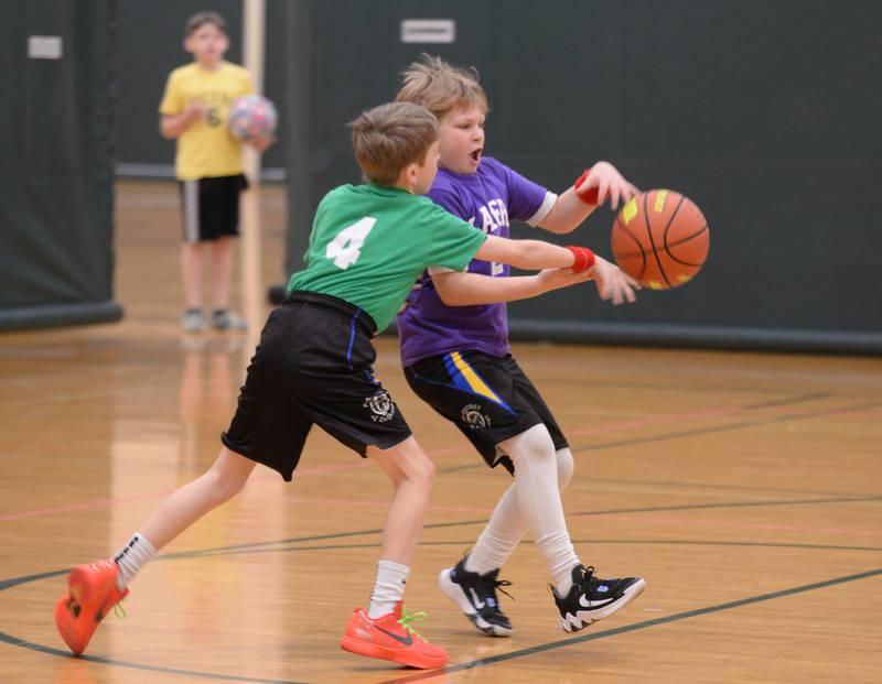 (left) Max Cusack and Shay Mattia participate in Youth Basketball held at the LaGrange Park District Saturday, Jan 6, 2024.