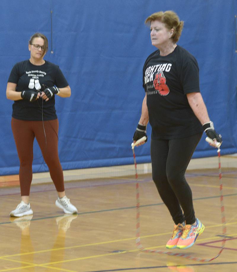 Elaine McKinney jumps rope during her Rocksteady Boxing class at the Streator YMCA. She is instructed by Nichole Reynolds.