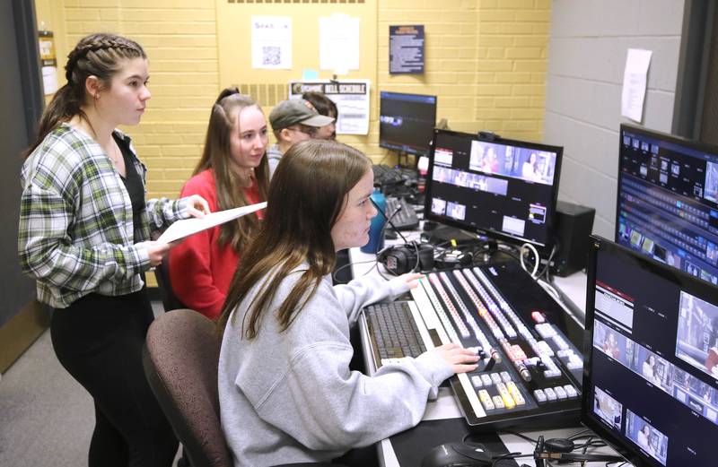 Sycamore High School students do studio work in the control room during the taping of a news program Wednesday, March 1, 2023, at the school.