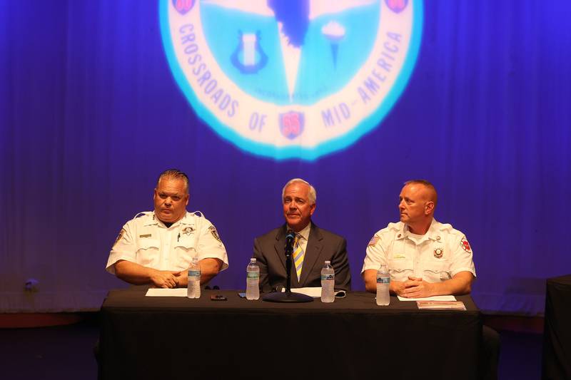 Joliet Police Chief Bill Evans, left, Mayor Terry D’Arcy and Joliet Fire Chief Jeff Carey sit center stage at the Public Safety Open Forum at the Billie Limacher Bicentennial Park Theatre on Wednesday June 26, 2024 in Joliet.