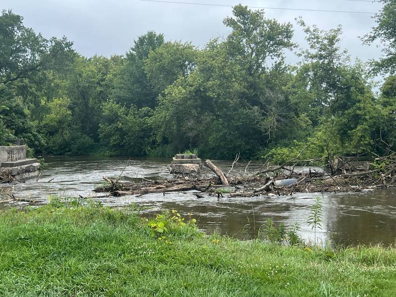 High waters seen flowing down the Kishwaukee River near Illinois Route 64 west of Sycamore Tuesday morning, July 16, 2024, following a second round of severe weather that hit DeKalb County Monday night, July 15, 2025.