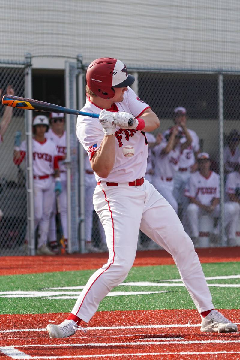 Yorkville's Nate Harris (15) is hit by a pitch during a baseball game against Plainfield North at Yorkville High School in Yorkville on Thursday, May 16, 2024.