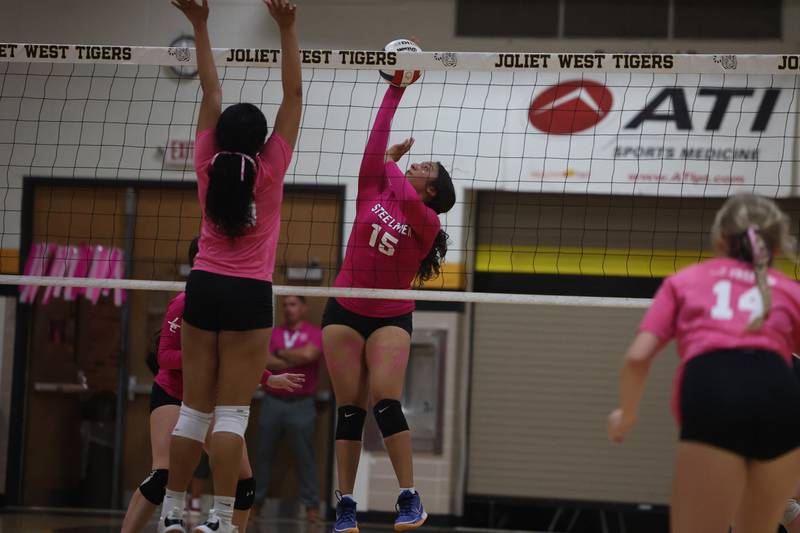 Joliet Central’s Gabby Leal goes for the kill against Joliet West in the JTHS Pink Heals match. Tuesday, Oct. 4, 2022, in Joliet.