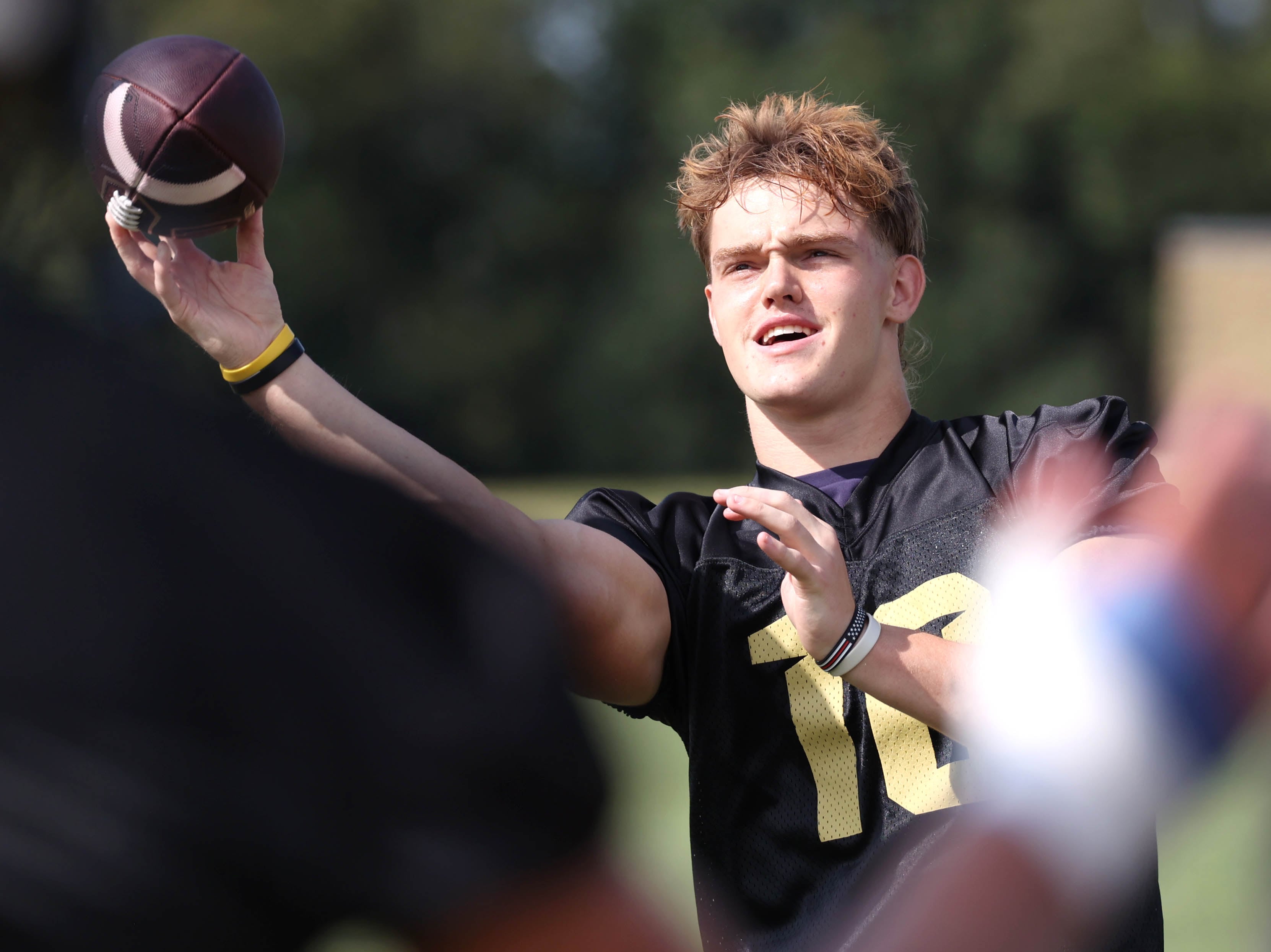 Sycamore quarterback Burke Gautcher warms up Monday, Aug. 12, 2024, for the first practice of the regular season.