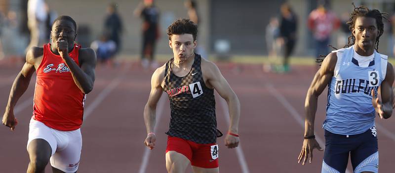 Rockford East’s Mechai Docket-Lewis, Huntley’s Vinny Costa, and Rockford Guilford’s Messiah Tilson race to the finish line in the 100 meter dash during the Huntley IHSA Class 3A Boys Sectional Track and Field Meet on Wednesday, May 15, 2024, at Huntley High School.