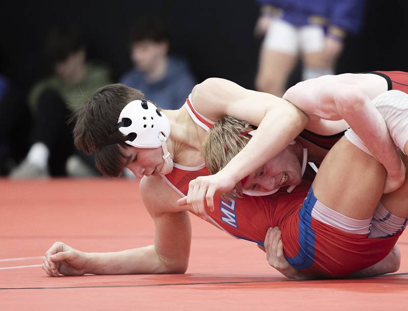 Morrison’s Caleb Modglin (left) and Erie’s Jacob Gibson battle it out for third place at 132 pounds Saturday, Feb. 3, 2024 during the class 1A Fulton wrestling regionals.