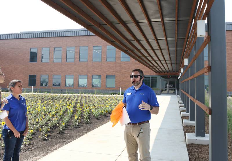 Clint Steketee, corn breeding project specialist with Syngenta, leads a tour Friday, June 23, 2023, during the grand opening of the Syngenta Seeds Research and Development Innovation Center in Malta.