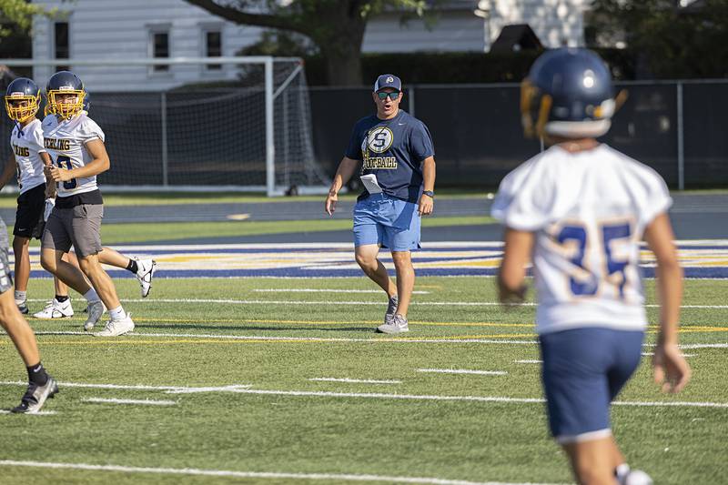 Sterling coach Jon Schlemmer leads his team against Newman during 7 on 7 drills Thursday, July 20, 2023.