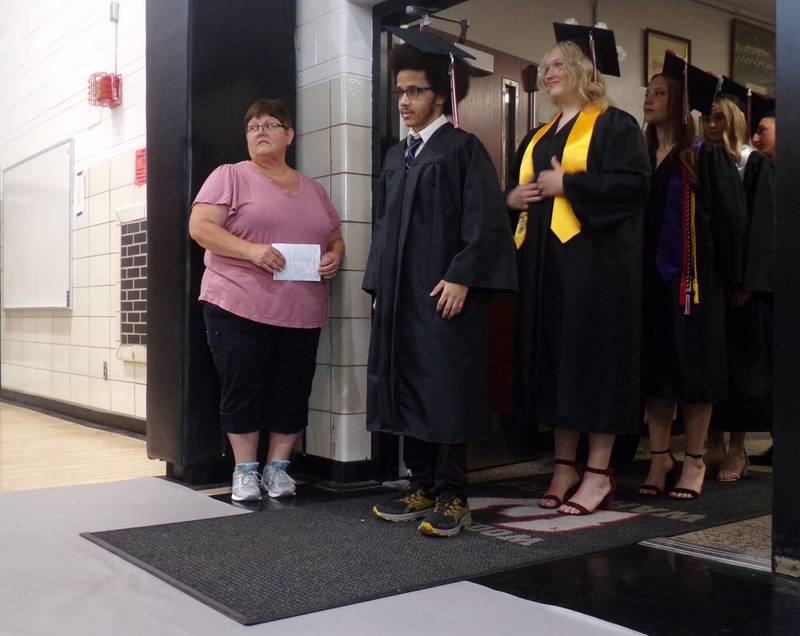 Woodland graduates enter the graduation ceremony Sunday, July 19, 2024, in the school's gymnasium.