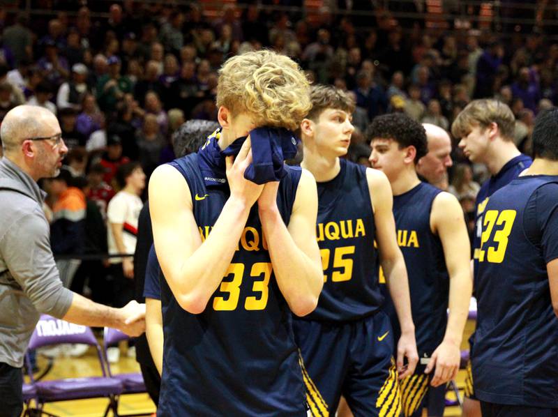 Neuqua Valley’s Joe Balgro covers his face following their Class 4A Downers Grove North Regional final loss against Downers Grove North on Friday, Feb. 23, 2024.