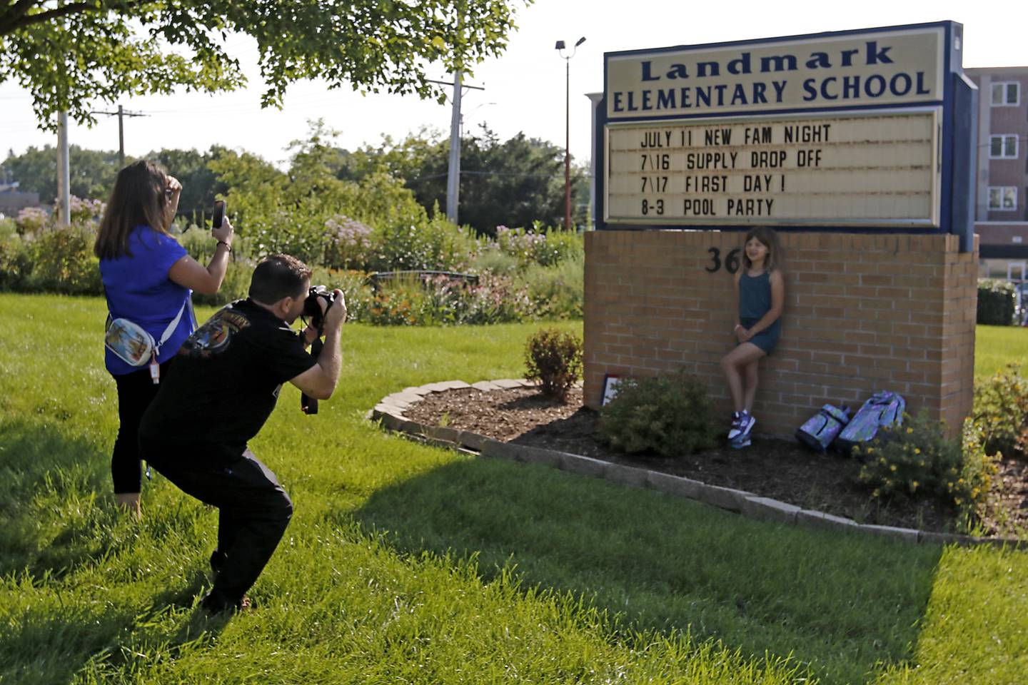 Third-grader Rowan Ziegler is photographed by her mom, Candace Esposite, and her dad, Rich Ziegler, before the first day of school for McHenry's Landmark Elementary School on Wednesday, July 17, 2024.