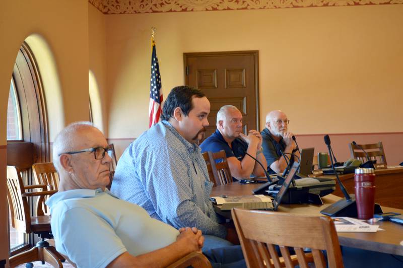 The Supervisor of Assessments and Planning and Zoning Committee on Tuesday, Aug. 13, 2024, voted 5-1-1 to support a petition from Constellation Energy Generation to rezone 524 acres of land around the Byron Generating Station. Left to right, Committee members Tom Smith, Ryan Reeverts, Vice Chairperson Ben Youman and member Stan Asp listen to public comment.