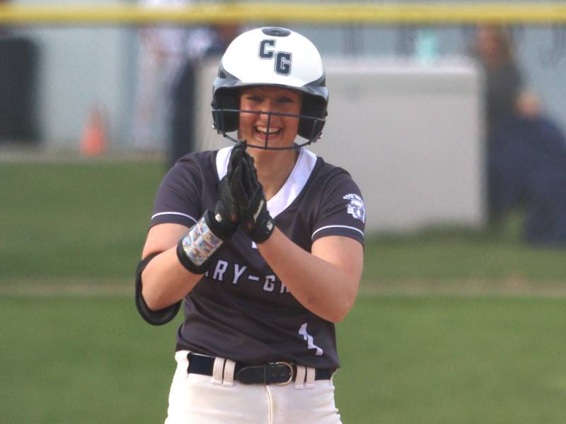 Cary-Grove’s Maddie Crick celebrates at third base with a triple against Burlington Central in varsity softball at Cary Monday. With the triple, Crick hit for the cycle.