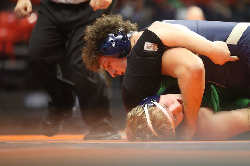 Lemont’s Alex Pasquale looks to pin Niles Notre Dame’s Scott Cook in the 285-pound Class 3A state 5th place match on Saturday, Feb. 17th, 2024 in Champaign.