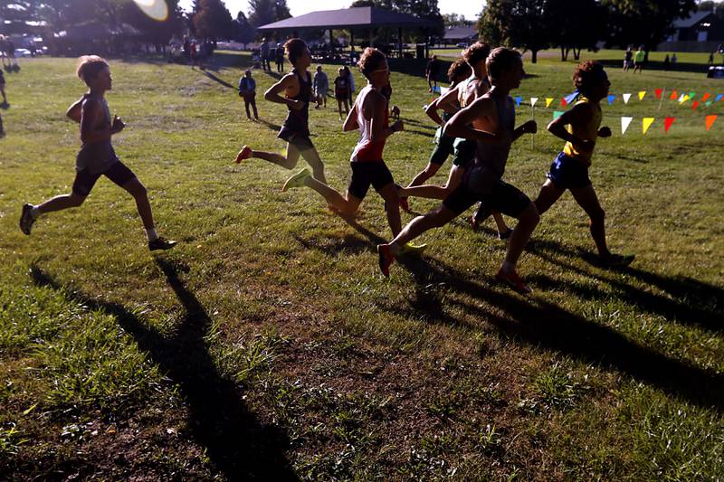 Runners compete in the boys race of the McHenry County Cross Country Invite on Saturday, August 31, 2024, at McHenry Township Park in Johnsburg.